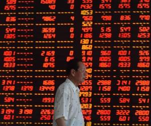 10 Jul 2015, Shenyang, Liaoning Province, China --- (150710) -- SHENYANG, July 10, 2015 (Xinhua) -- An investor walks at a securities firm in Shenyang, northeast China's Liaoning Province, July 10, 2015. Chinese shares staged a two-day strong rebound after intensive moves by the government to bolster the market. The benchmark Shanghai Composite Index leaped 4.54 percent to finish at 3,877.8 points on Friday. The Shenzhen Component Index surged 4.59 percent to close at 12,038.15points. (Xinhua/Pan Yulong) (wf) --- Image by Â© Pan Yulong/Xinhua Press/Corbis