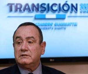 Guatemala's president-elect Alejandro Giammattei (C), flanked by Vice President-elect Guillermo Castillo (2ndL) and designated Minister of Foreign Affair Pedro Brolo (L) arrives for a press conference at La Aurora airport in Guatemala City, on October 12, 2019. - Giammattei denounced the fact that he was denied entry into Venezuela, where he traveled to meet with opposition leader Juann Guaido, who has been recognized as interim president of Venezuela by about 50 countries. (Photo by Johan ORDONEZ / AFP)