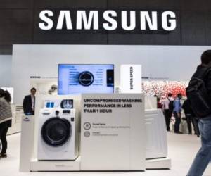 (FILES) This file photo taken on September 3, 2015 shows a washing machine featured at the home appliances section at the booth of South Korean electronics giant Samsung ahead of the opening of the 55th IFA (Internationale Funkausstellung) electronics trade fair in Berlin.Samsung plans to invest $380 million and hire nearly 1,000 workers for a new manufacturing plant for home appliances in South Carolina, the company announced on June 28, 2017. Samsung Electronics America described the plant as a 'state of the art' facility and alluded in a news release to incentives granted by the state government as a factor in the decision. / AFP PHOTO / John MACDOUGALL