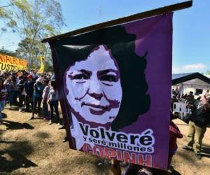 Environmental activists take part in a ceremony on the eve of the third anniversary of Honduran environmentalist Berta Caceres' murder in La Esperanza, 110 kilometers east of Tegucigalpa, on March 02, 2019. - Hundreds of activists gather to commemorate the third anniversary of the murder of Berta Caceres, who was killed for opposing the construction of a hydroelectric dam on a river. Seven people have been convicted for the crime. (Photo by ORLANDO SIERRA / AFP)