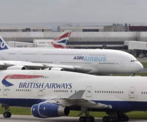 landing with reverse-thrust on runway 27L first visit of an A380 to the UK in a strong southerly crosswind with British Airways Boeing 747s taxiing in front and behind at Terminal4. (Photo by: aviation-images.com/Universal Images Group via Getty Images)