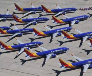 (FILES) In this file photo taken on March 28, 2019 Southwest Airlines Boeing 737 MAX aircraft are parked on the tarmac after being grounded, at the Southern California Logistics Airport in Victorville, California. - Boeing reported lower first-quarter profits on April 24, 2019, as the global grounding of its 737 MAX plane following two crashes hit results. The US aerospace giant reported $2.1 billion in profits, down 13.2 percent from same period a year ago. Boeing also withdrew its full-year profit forecast due to uncertainty surrounding the 737 MAX. (Photo by Mark RALSTON / AFP)