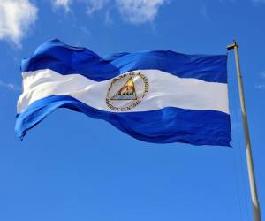 Nicaraguan flag waving in the wind at Plaza de la Revolución / Plaza de la República, Managua