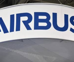 (FILES) This file photo taken on October 22, 2019 shows the Airbus logo at its stand during the the 70th annual International Astronautical Congress at the Walter E. Washington Convention Center in Washington, DC. - Airbus announced on July 30, 2020 losses of 1.9 billion euros (2.2 billion USD) in the first six months a two-fold drop in aircraft delivery as a result of the impact of the coronavirus pandemic. (Photo by MANDEL NGAN / AFP)