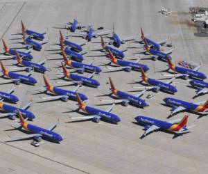 Southwest Airlines Boeing 737 MAX aircraft are parked on the tarmac after being grounded, at the Southern California Logistics Airport in Victorville, California on March 28, 2019. - After two fatal crashes in five months, Boeing is trying hard -- very hard -- to present itself as unfazed by the crisis that surrounds the company. The company's sprawling factory in Renton, Washington is a hive of activity on this sunny Wednesday, March 28, 2019, during a tightly-managed media tour as Boeing tries to communicate confidence that it has nothing to hide. Boeing gathered hundreds of pilots and reporters to unveil the changes to the MCAS stall prevention system, which has been implicated in the crashes in Ethiopia and Indonesia, as part of a charm offensive to restore the company's reputation. (Photo by Mark RALSTON / AFP)