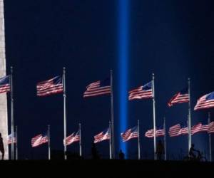 The 'Tower of Light,' a beam of light that pays tribute to those killed during the September 11, 2001 attacks at the Pentagon, illuminates the sky over the Pentagon as seen from the Washington Monument on the National Mall in Washington, DC, September 9, 2021, ahead of the 20th anniversary of the attacks. (Photo by SAUL LOEB / AFP)