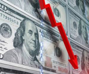 Loss in American dollar. Red arrow graph is showing a drastic fall over American dollar background. Selective focus. Horizontal composition with copy space.