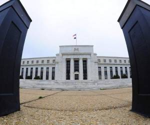 (FILES) This file photo taken on April 2, 2009 shows the US Federal Reserve building in Washington, DC. US central bankers say they may need to raise interest rates faster than planned, noting 'considerable uncertainty' about the expected fiscal stimulus policy of Donald Trump, according to the minutes of the Fed's final 2016 policy meeting released on January 4, 2017. A Trump stimulus package could boost demand above sustainable levels, 'potentially necessitating somewhat tighter monetary policy than currently anticipated,' many participants in the December 13-14 meeting said. / AFP PHOTO / KAREN BLEIER