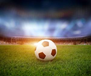 Soccer ball on the field of stadium with light