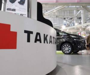 (FILES) This file photo taken on January 13, 2017 shows the logo of the Japanese auto parts maker Takata displayed at a car showroom in Tokyo.Shares in embattled airbag maker Takata soared more than 40 percent on June 23, 2017, after collapsing over the past week on bets that the crisis-hit firm will file for bankruptcy next week. / AFP PHOTO / Kazuhiro NOGI