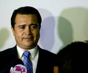 The brother of Honduran President Juan Orlando Hernandez and deputy for the ruling Partido Nacional de Honduras, Juan Antonio Hernandez prepares to speak with the press upon arrival at the Toncontin international airport from the United States, on October 25, 2016 in Tegucigalpa. - Earlier this month, Honduran army captain Santos Rodriguez Orellana accused the US Drug Enforcement Administration (DEA) of pressuring him to implicate Hernandez of involvement in a plan to kill the US ambassador, whilst the US is investigating Orellana for alleged corruption and ties to drugs gangs. President Hernandez pledged not to support his brother if it turns out the army captain is involved in drug-related crime as alleged. (Photo by ORLANDO SIERRA / AFP)