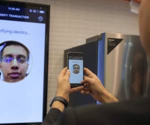 Raghav Malik, Senior Analyst in Enterprise Security Solutions doing a product demonstration of Identity Check in MasterCard stand at the Mobile World Congress in Barcelona, Spain, Monday, Feb. 22, 2016. The company displayed the future of payments for devices and wearables. (Carlos Alonso/AP Images for MasterCard)