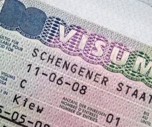 Close-up page of passport with Schengen visa