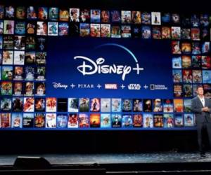 (FILES) In this file photo taken on November 13, 2019 the Disney+ logo is seen on the backdrop for the World Premiere of 'The Mandalorian' at El Capitan theatre in Hollywood. - Disney has added extended disclaimers to classics including 'Peter Pan' and 'Aristocats' on its streaming platform to warn viewers that the films contain derogatory stereotypes about minorities. (Photo by Nick Agro / AFP)