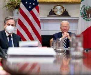 President Joe Biden, accompanied by White House national security adviser Jake Sullivan, left, and Secretary of State Antony Blinken, second from left, attends a virtual meeting with Mexican President Andres Manuel Lopez Obrador, in the Roosevelt Room of the White House, Monday, March 1, 2021, in Washington. (AP Photo/Andrew Harnik)