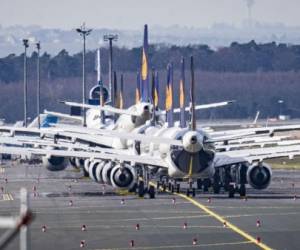 15 March 2020, Hessen, Frankfurt/Main: Numerous Lufthansa aircraft are parked on the extensive grounds of Frankfurt Airport. Lufthansa has been severely affected by the severe slump in demand caused by the novel corona virus and has cancelled the lion's share of its flight offerings for the coming weeks. Photo: Frank Rumpenhorst/dpa (Photo by Frank Rumpenhorst/picture alliance via Getty Images)