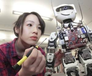 female student building robot