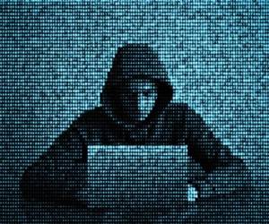 Hacker in data security concept. Hacker using laptop. Hacking the Internet. Cyber attack.