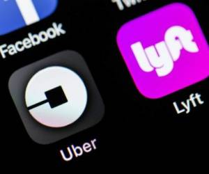 ANKARA, TURKEY - AUGUST 31: Uber and Lyft application logos arae seen on a screen in Ankara, Turkey on August 31, 2018. (Photo by Ali Balikci/Anadolu Agency/Getty Images)