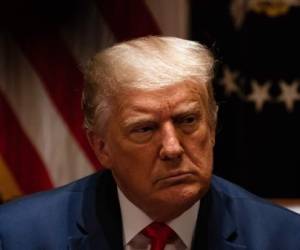 WASHINGTON, DC - JULY 31: U.S. President Donald Trump listens during a meeting with members of the National Association of Police Organizations Leadership in the Cabinet Room of the White House July 31, 2020 in Washington, DC. (Photo by Anna Moneymaker-Pool/Getty Images)