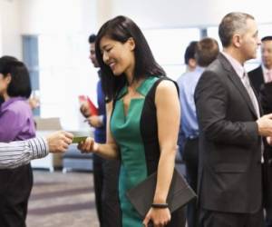 Exchanging business cards at conference