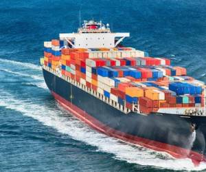 A large cargo container ship out to sea.