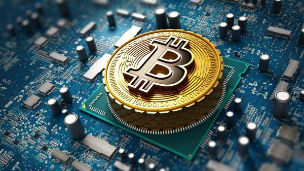 <i>Crypto currency / Blockchain concept with coin on the motherboard.</i>