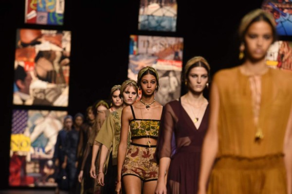 Models present creations by Dior during the Paris Fashion Week's Women Spring Summer 2021 ready-to-wear fashion show in Paris, on September 29, 2020. (Photo by Lucas BARIOULET / AFP)