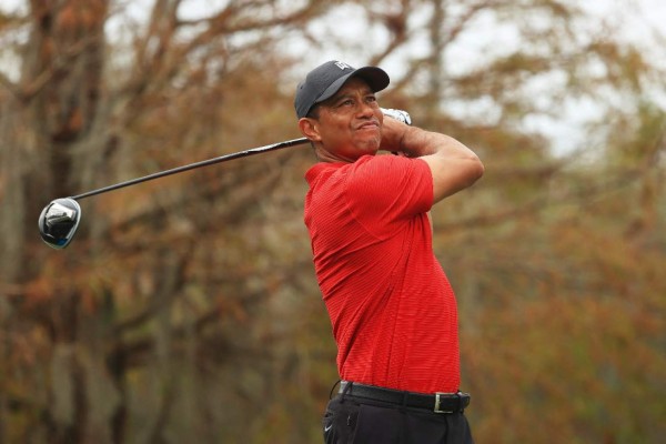 ORLANDO, FLORIDA - DECEMBER 20: Tiger Woods of the United States plays his shot from the ninth tee during the final round of the PNC Championship at the Ritz-Carlton Golf Club Orlando on December 20, 2020 in Orlando, Florida. Mike Ehrmann/Getty Images/AFP (Photo by Mike Ehrmann / GETTY IMAGES NORTH AMERICA / Getty Images via AFP)