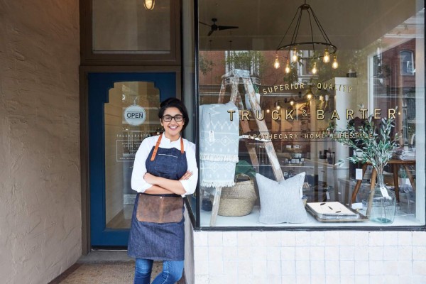 Portrait of millennial Hispanic small business owner of artisan retail store