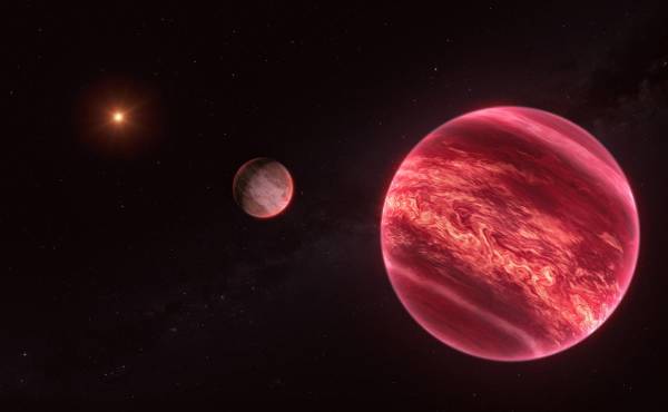 <i>Representación artística que muestra el sistema alrededor de la estrella CD-35 2722, con el objeto recientemente descubierto similar a una luna en el centro.- EFE/ESO/M. Kornmesser</i>