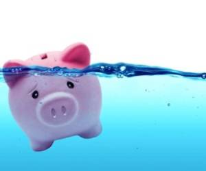 Piggy bank drowning in water