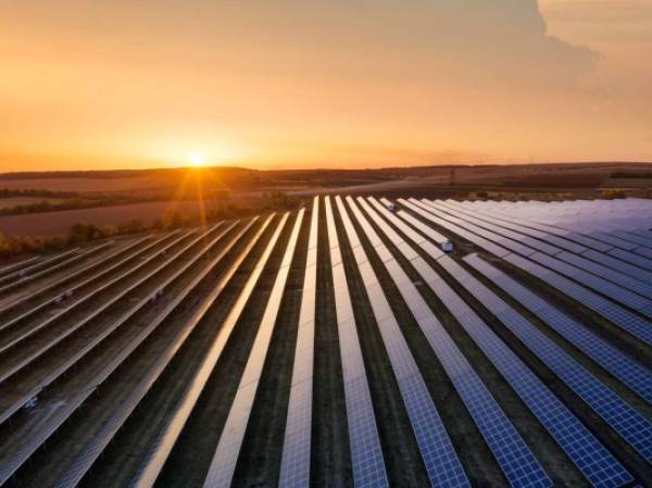 Aerial view on the solar panel. Technologies of renewable energy sources. View from air. Industrial landscape during sunset. Technologi - image