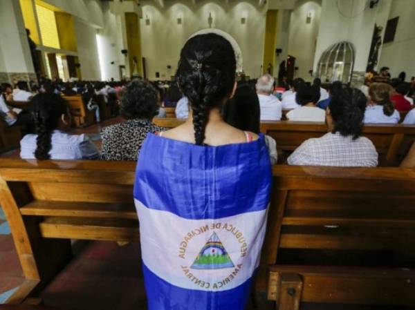 Catholics participate of a mass demanding the freedom of political prisoners in Managua's Cathedral, in Managua on October 21, 2018. (Photo by INTI OCON / AFP)