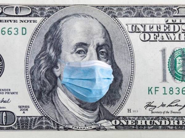 Coronavirus Wuhan. US quarantine, 100 dollar banknote with medical mask. The concept of epidemic and protection against coronavrius.