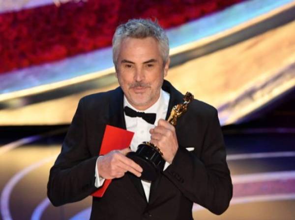 Best Foreign Language Film nominee for 'Roma' Mexican director Alfonso Cuaron accepts the award for Best Foreign Language Film during the 91st Annual Academy Awards at the Dolby Theatre in Hollywood, California on February 24, 2019. (Photo by VALERIE MACON / AFP)