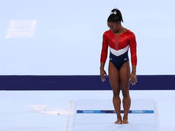 TOKYO, JAPAN - JULY 27: Simone Biles of Team United States competes on vault during the Women's Team Final on day four of the Tokyo 2020 Olympic Games at Ariake Gymnastics Centre on July 27, 2021 in Tokyo, Japan. (Photo by Jamie Squire/Getty Images)