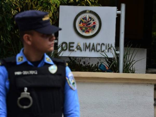 El presidente, Juan Orlando Hernández, dio el anuncio luego que el Gobierno no ratificó la continuidad de la Misión de Apoyo Contra la Corrupción y la Impunidad en Honduras (Maccih) con la OEA. Foto ORLANDO SIERRA / AFP