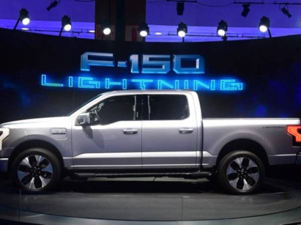 The all-electric F-150 Lightning from Ford is displayed at the Los Angeles Auto Show in Los Angeles, California on November 18, 2021. (Photo by Frederic J. BROWN / AFP)