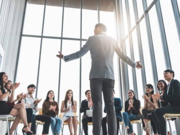 Business people clapping hands during meeting in office for their success in business work