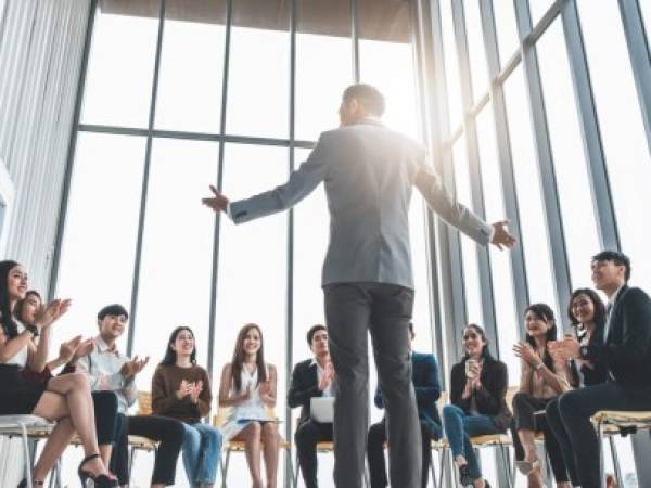 Business people clapping hands during meeting in office for their success in business work